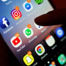 Social media apps displayed on a mobile phone screen. PIC: Yui Mok/PA Wire