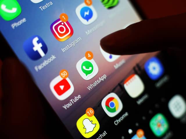 Social media apps displayed on a mobile phone screen. PIC: Yui Mok/PA Wire