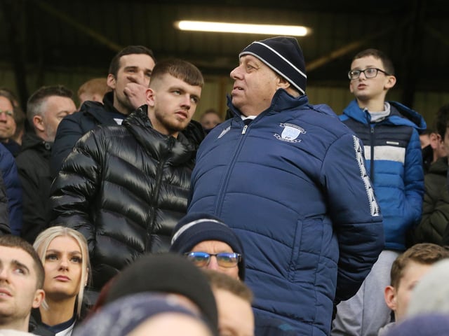 Preston North End fans anxiously watch the second half action