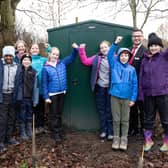 Redrow representative Paul Fishwick and Year six pupils and staff with the shed