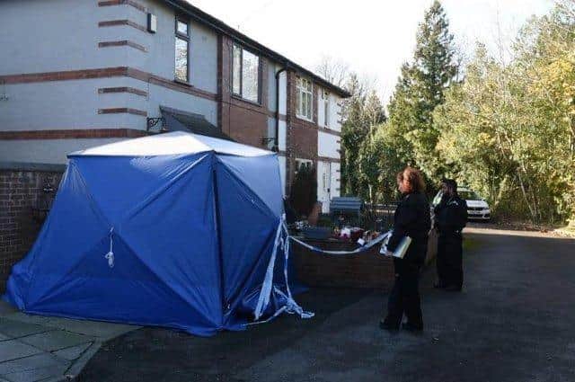 The police scene outside the couple's home where their bodies were discovered on November 20, 2021
