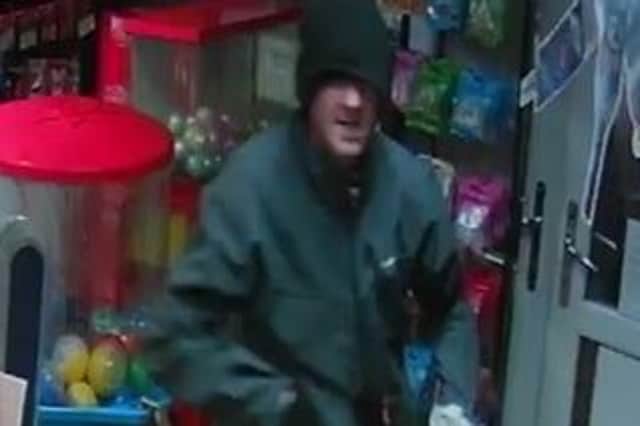 Police want to identify this man after a robbery at a Bargain Booze store in Chorley (Credit: Lancashire Police)