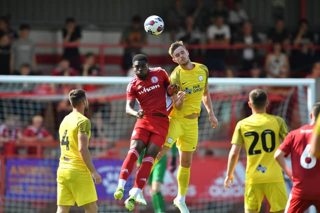 Liam Lindsay challenges for the ball at Accrington.