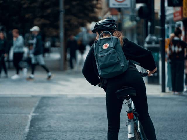 Ways to reduce laptop-induced commuter back pain. Photo credit: Ross Sneddon