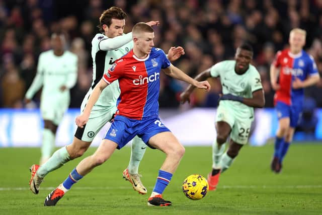 LONDON, ENGLAND - FEBRUARY 12: Adam Wharton of Crystal Palace holds off Ben Chilwell of Chelsea during the Premier League match between Crystal Palace and Chelsea FC at Selhurst Park on February 12, 2024 in London, England. (Photo by Julian Finney/Getty Images)