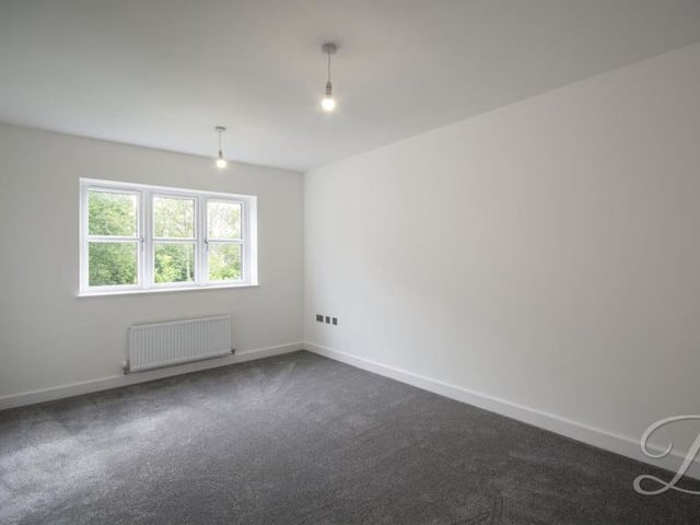 The fourth bedroom overlooks the front of the £800,000 Ravenshead property. Again it has a carpeted floor and a central heating radiator. All the bedrooms present a perfect canvas for you to add your own mark.