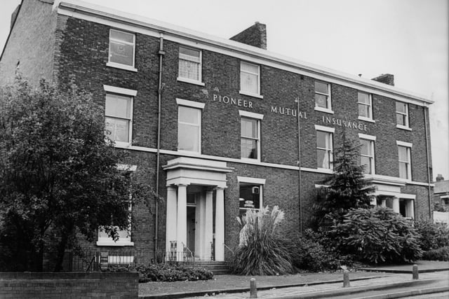 Does anyone know anything about this property, occupied by Pioneer Mutual Insurance when this image was taken, probably in the 1980s