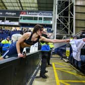 Preston North End's Alvaro Fernandez gives his shirt to a fan after the match