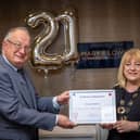 Helen Souter from Cancer Research UK thanks Vincents Solicitors' Chris Mathews for 21 years of help