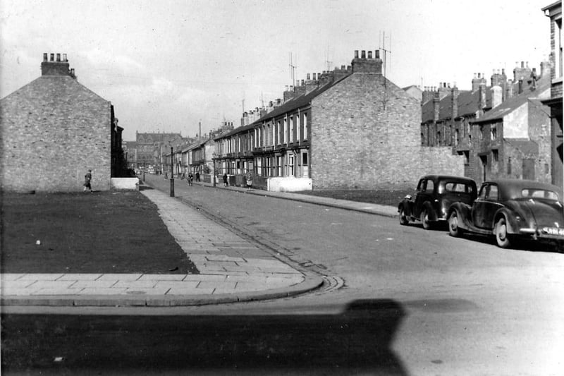 A 1955 view of the street with cleared areas also showing. They were the result of bombing in 1941.