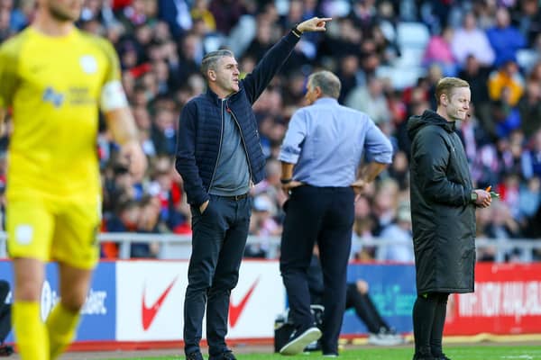 Preston North End manager Ryan Lowe shouts instructions to his team from the technical area.