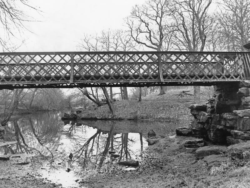 The condemned bridge over the Serpentine Lake in Moor Park, Preston. The bridge had fallen into disrepair was to deemed to be too costly to fix, so it was set to be removed before the Preston Guild in 1992