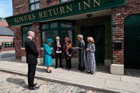 MANCHESTER, ENGLAND - JULY 08: Queen Elizabeth II meets actors William Roache, fourth right, Barbara Knox, third right, Sue Nicholls and Helen Worth, right, during a visit to the set of the long running television series Coronation Street, on July 8, 2021 in Manchester, England. (Photo by Scott Heppell - WPA Pool/Getty Images))