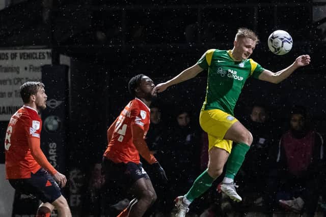 Preston North End's Ali McCann heads clear against Luton Town