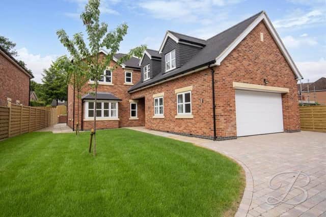 This £800,000 four-bedroom home on Longdale Lane, Ravenshead represents a haven of luxury for one lucky family. As you can see, the long driveway, accessed via electric gates, leads to an integral garage.