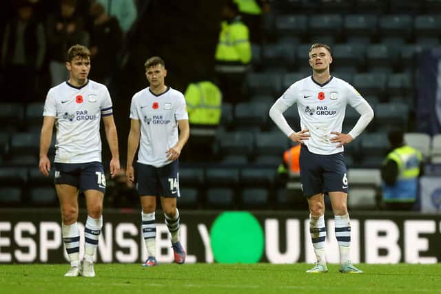 Preston North End players react after Millwall's Charlie Cresswell scored his side's fourth goal