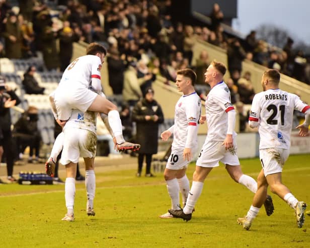 Danny Ormerod is mobbed by his team-mates after earning a late point. PICTURE: AFC Fylde