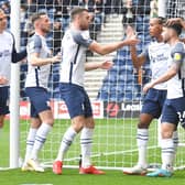 Preston North End players celebrate scoring the first goal of the game.