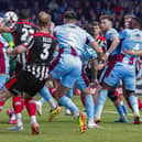 Chorley's Kole Hall scores the first of his two goals at Scunthorpe United (photo: David Airey)