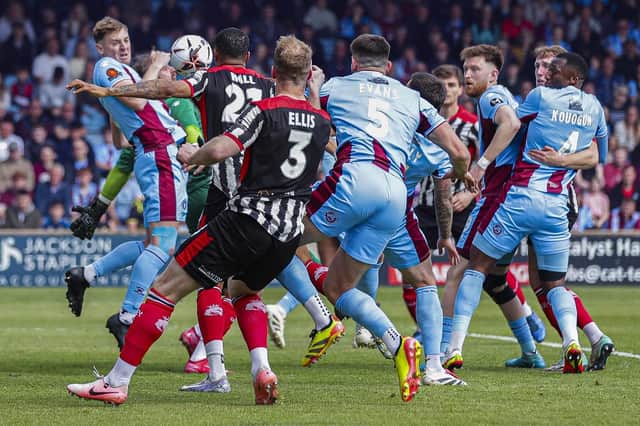 Chorley's Kole Hall scores the first of his two goals at Scunthorpe United (photo: David Airey)