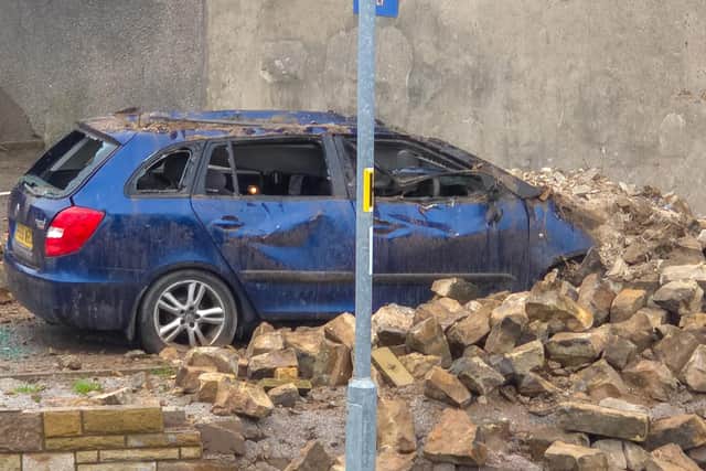 The damaged car parked in Kwik Fit.