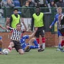 Chorley's Billy Whitehouse in the thick of the action against Buxton (photo: David Airey/dia_images)