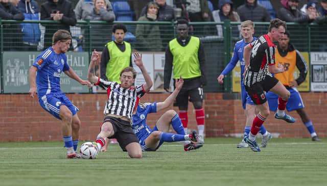 Chorley's Billy Whitehouse in the thick of the action against Buxton (photo: David Airey/dia_images)