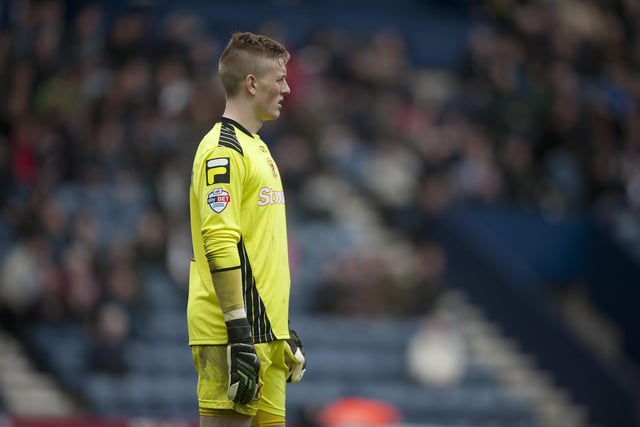 Carlisle United's goalkeeper Jordan Pickford watches on.