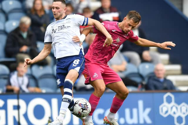 Preston North End's Alan Browne battles with Swansea City's Jerry Yates