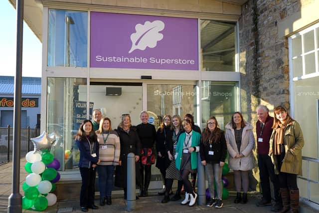 A team photo outside the new St John's Hospice sustainable superstore in Lancaster.