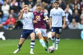 Preston North End's Ali McCann battles with Burnley's Josh Brownhill 
