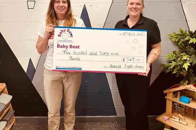 Michelle Mosoph (right), owner of Absolute Angels Nursery and Pre-School, presents Baby Beat’s Joanna Allitt with the donation raised by her young charges, who walked a mile a day every day for a full week