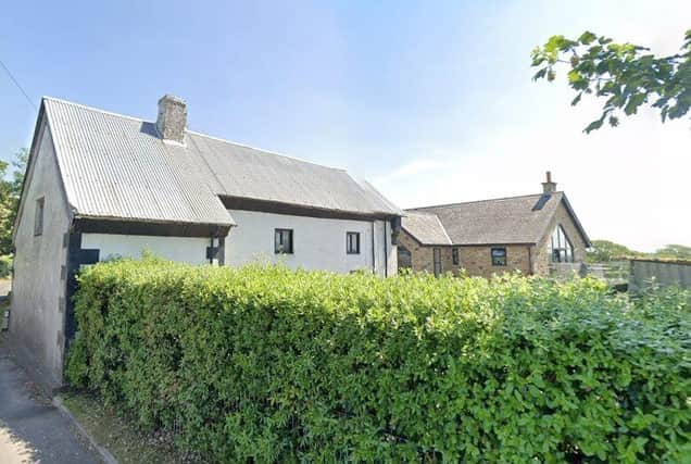 The white cottage-style property at Bourne Brow Farm should have been demolished before the new dwelling behind it was built in 2011 - but now it can remain (image: Google)