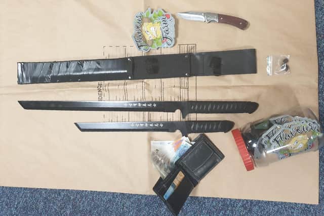 Drugs, samurai swords and lock knives were recovered after a car was stopped on the M6 (Credit: Lancashire Police)