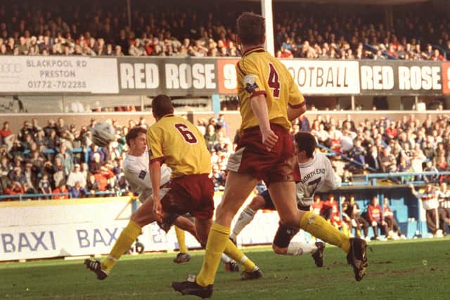 Jonathan Macken and Steve Basham both swing at the ball for Preston North End's third goal against Northampton Town at Deepdale in March 1999