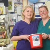 Staff at the Veterinary Health Centre are raising money for Oliver, 16, by riding a bike and selling cakes.  Pictured is Oliver's mum Sheena Johnson with Sarah Veevers.