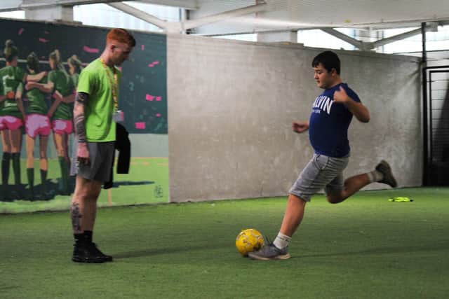A participant plays football at Inspire Chorley Youth Zone