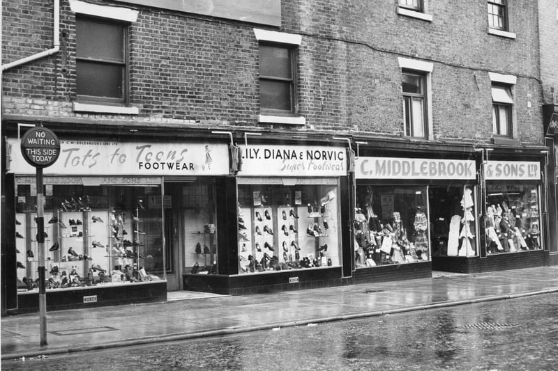 This picture of Middlebrook & Sons and a shoe shop next door is undated but must have been taken before the next picture which shows the shops in 1977, all boarded up and closed for business