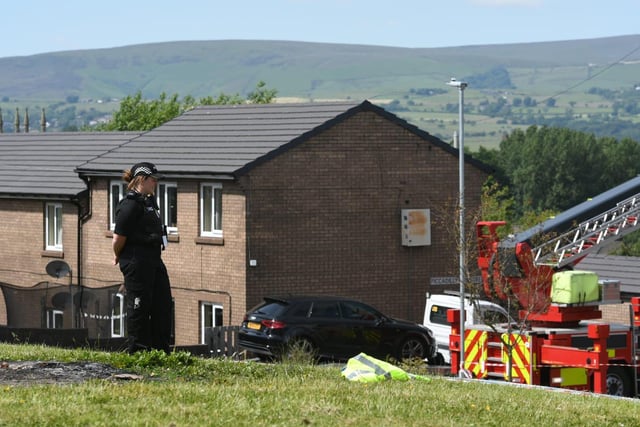 A police officer watches over the scene