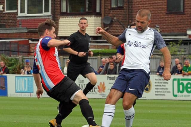 John Welsh of the PNE Legends XI tackles Bamber Bridge Vets' Mitch Newsome. Pic: Steven Taylor Photography