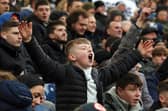 Preston North End fans celebrate after Tom Cannon scored his side's second goal