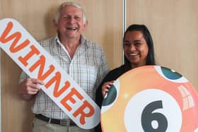 Bob Woof, an 82-year-old blind veteran from Carnforth, celebrates winning £25,000