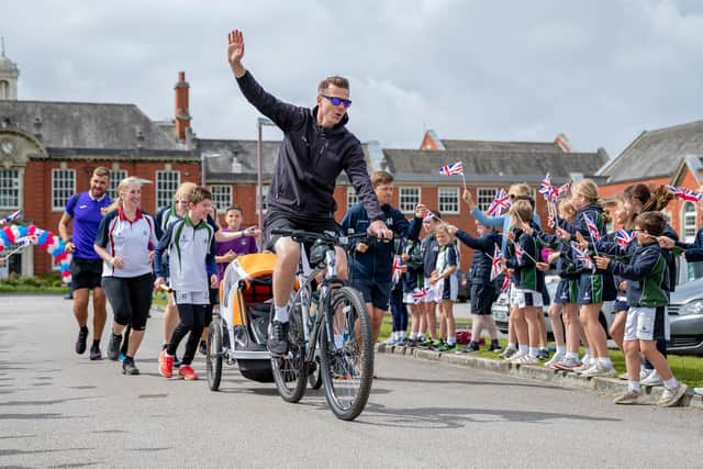 Lee Cadwallader leaves AKS with the SPAR Lancashire School Games baton,  which arrived from Lytham Hall Park on the baton relay Picture: SAM FIELDING
