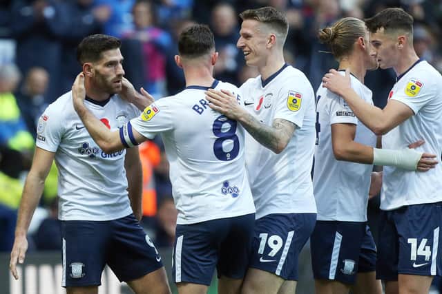 Preston North End's Ched Evans (left) celebrates with team-mates after scoring his side's equalising goal to make the score 2-2 against Millwall