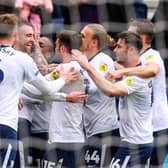 Preston North End's Ben Whiteman celebrates scoring his side's second goal against Blackpool with teammates