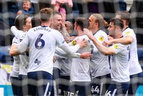 Preston North End's Ben Whiteman celebrates scoring his side's second goal against Blackpool with teammates