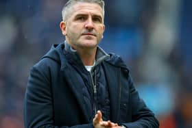 Preston North End manager Ryan Lowe leaves the field after the match.