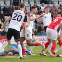 Jonah Ayunga hooks home Morecambe's equaliser against Portsmouth