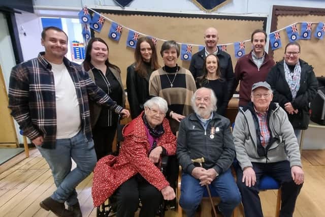 Nelson man Frank Dinsdale (pictured in the centre of the front row) has been decorated with a medal for his service in the Royal Air Force during the nuclear testing on Christmas Island in the 1950s. He is pictured here with his family who arranged a surprise presentation of the medal for him