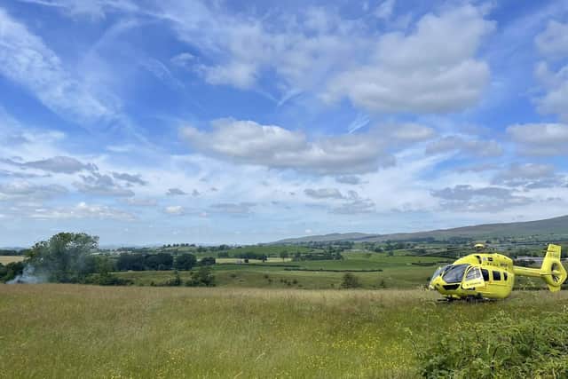 The air ambulance at the scene of a helicopter crash in Burton-in-Lonsdale. Picture by Thomas Beresford.